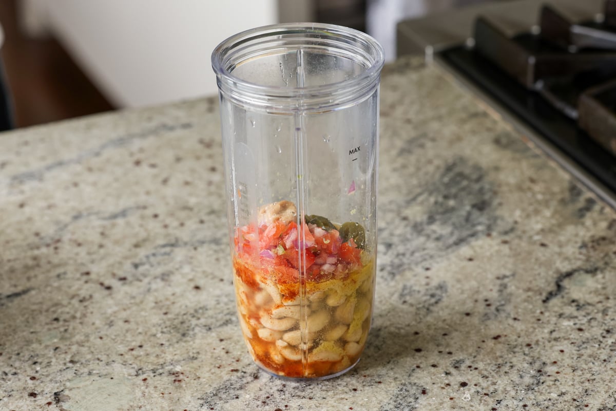 cashews and seasonings in the blender before blending