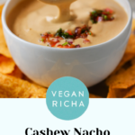 dipping a chip into cashew nacho cheese in a serving bowl topped with salsa, text overlay