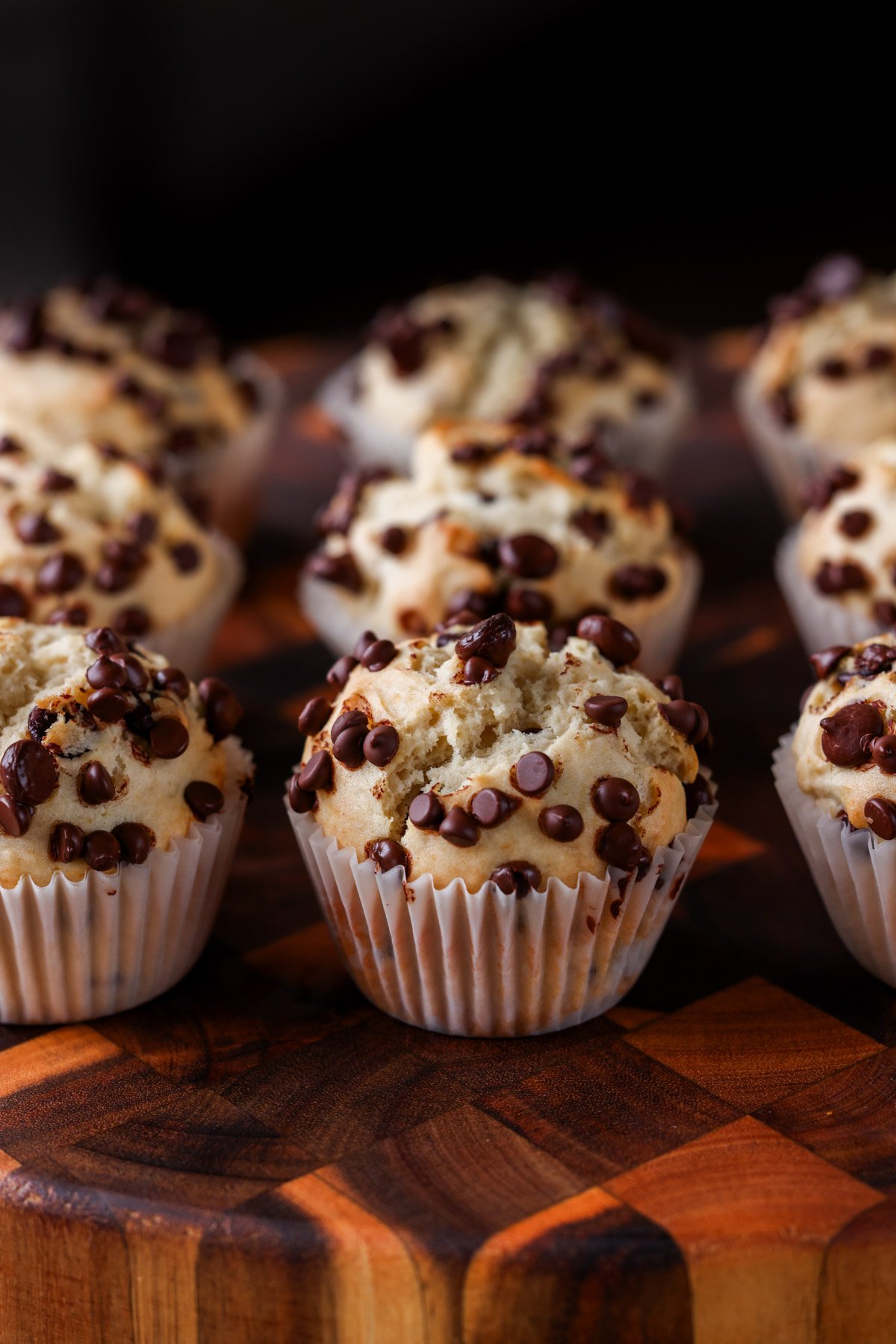 chocolate chip muffins on a cutting board