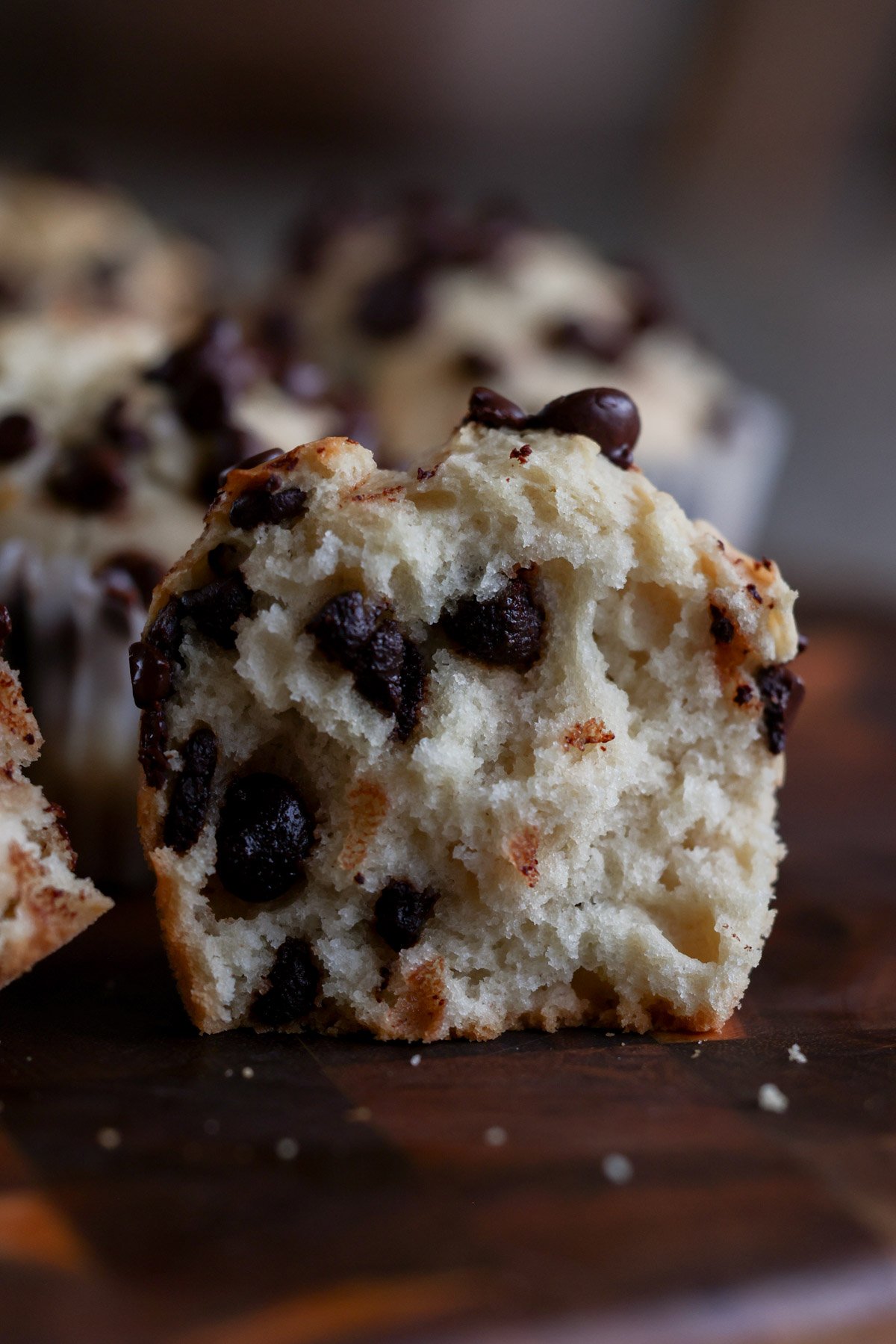 chocolate chip muffin cut in half, so you can see the fluffy texture inside