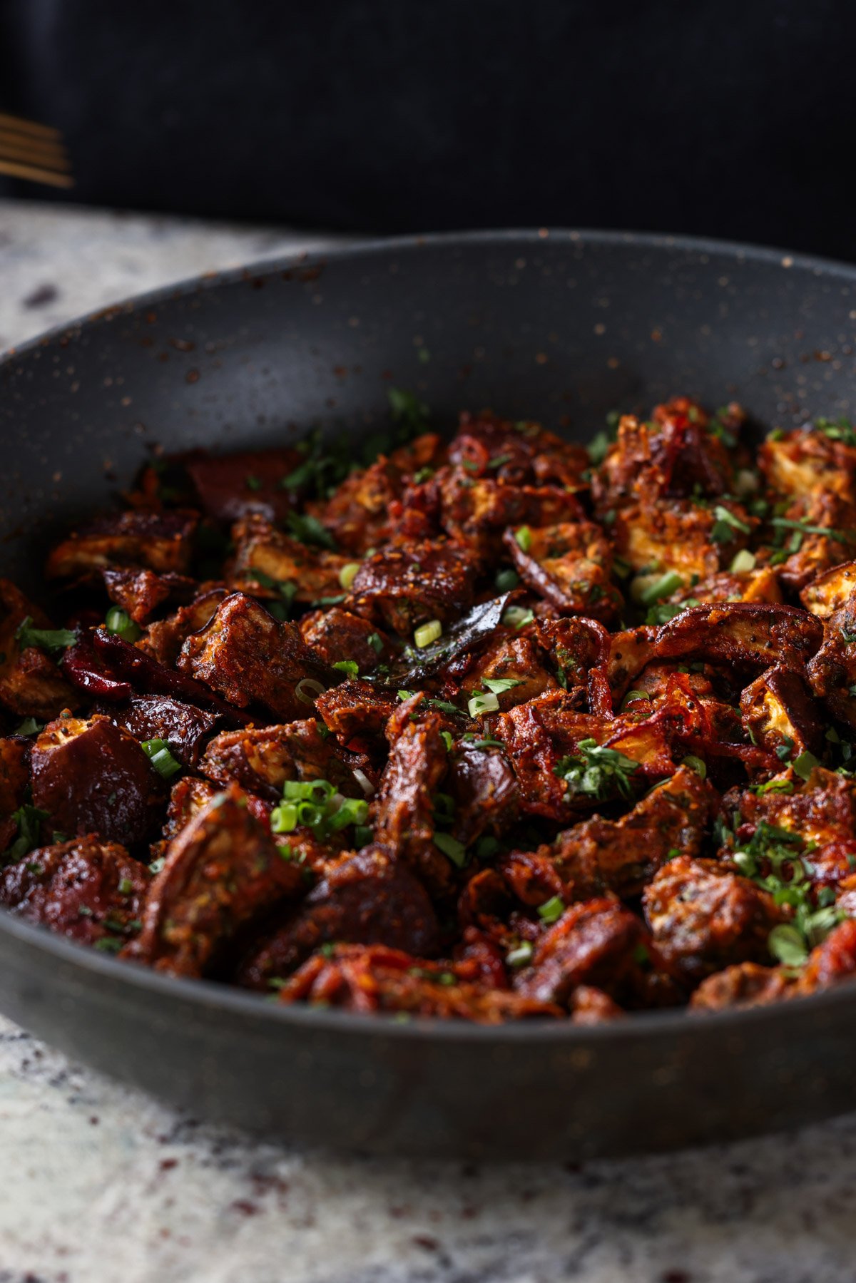 close-up of malabar eggplant in the pan