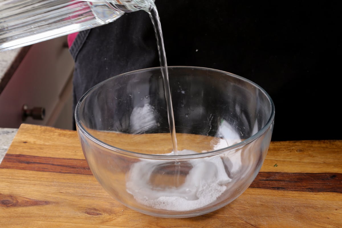 mixing water and salt in a bowl