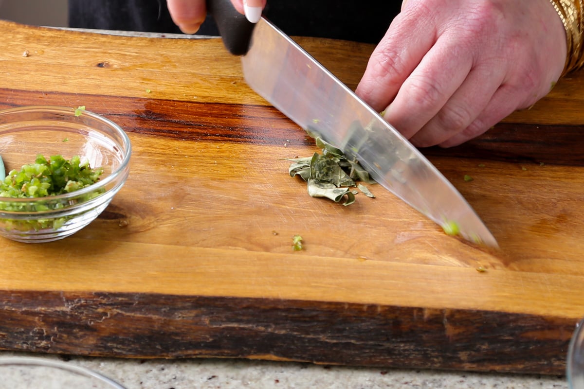 chopping the curry leaves