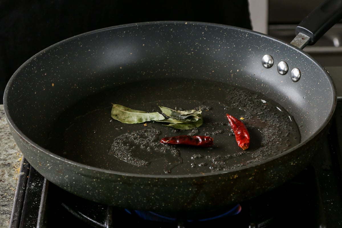 roasting the whole spices in a pan