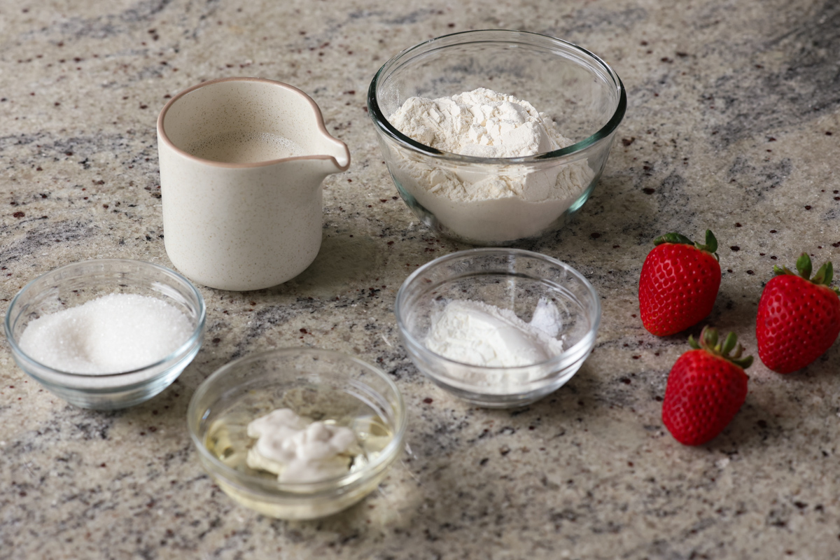 cake ingredients in bowls on the kitchen counter