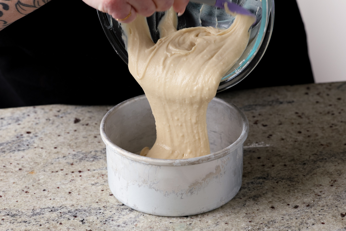 pouring the cake batter into the pan