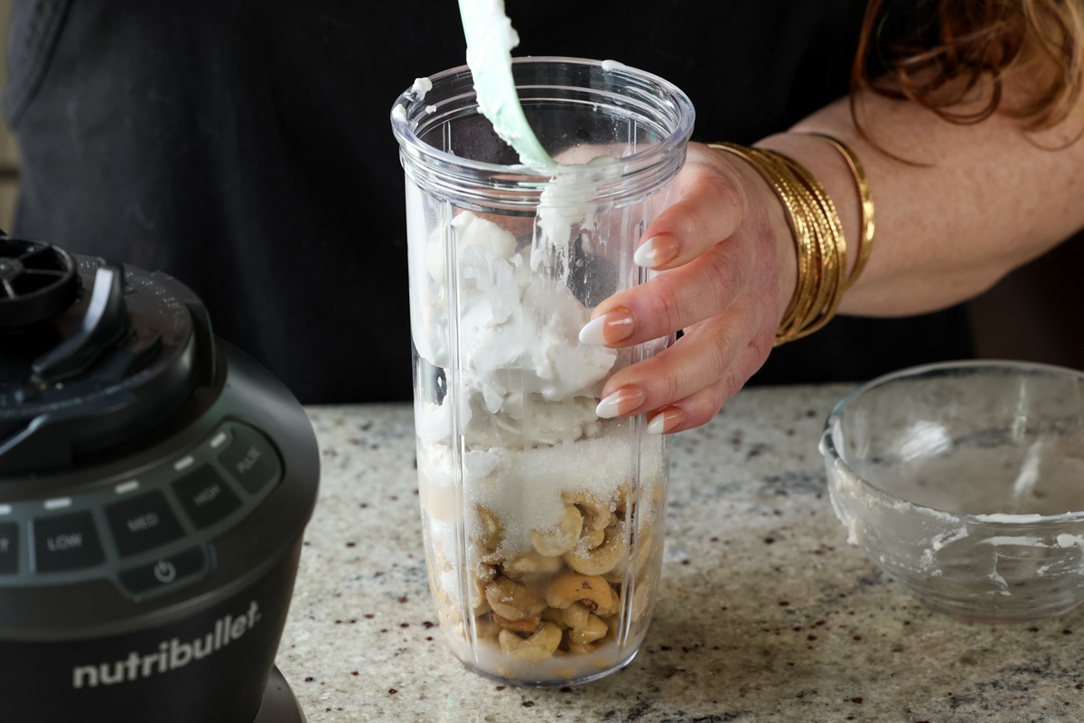adding mousse ingredients to the blender