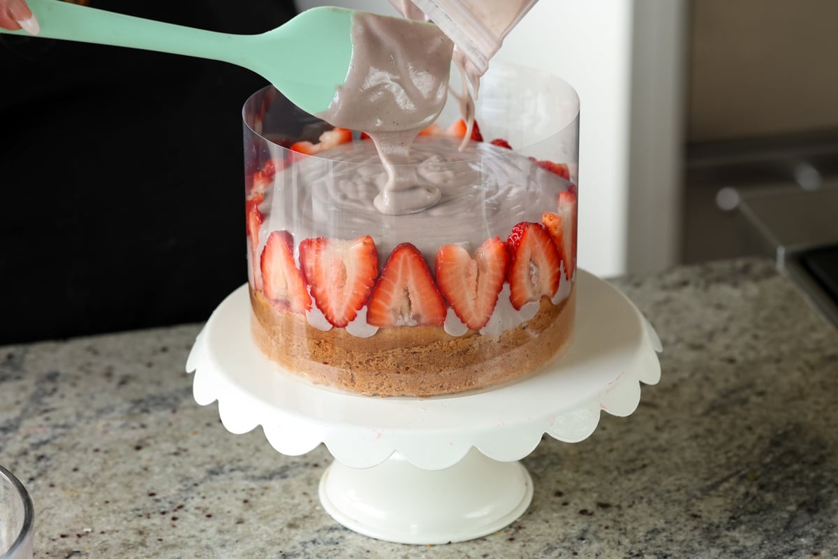 pouring on the strawberry mousse