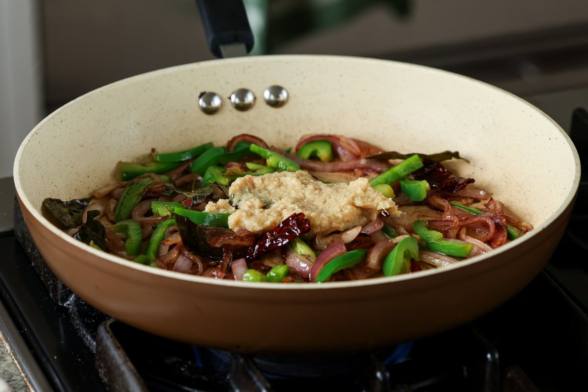 adding ginger garlic paste to the pan