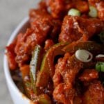 extreme close-up of tofu kondattam in a bowl over rice