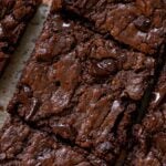 extreme close-up of sliced almond butter brownies on the cutting board