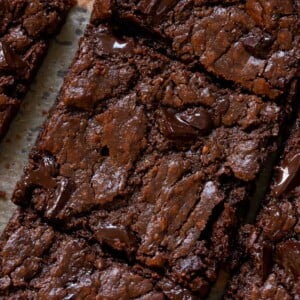 extreme close-up of sliced almond butter brownies on the cutting board