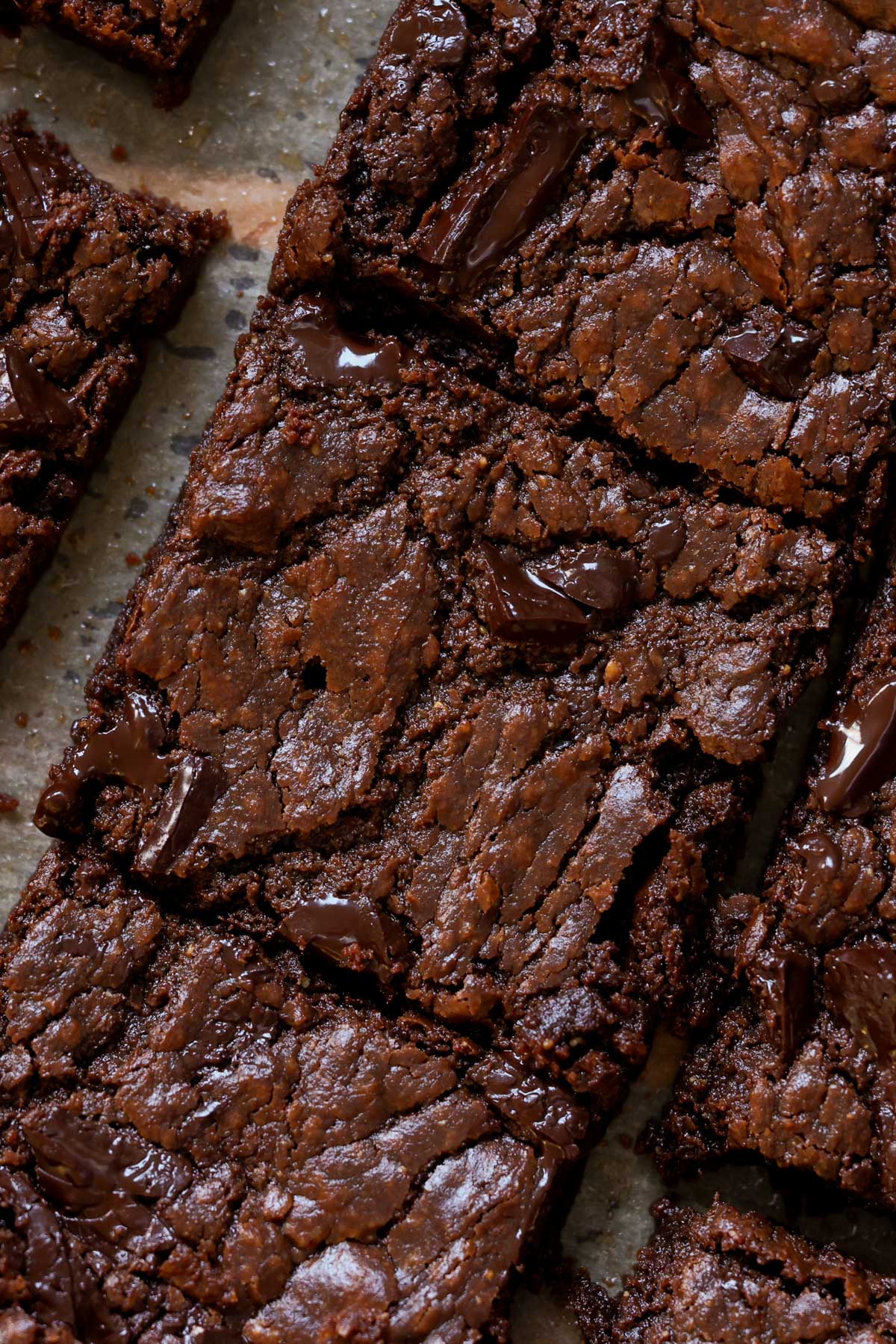 extreme close-up of sliced almond butter brownies on the cutting board