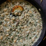 kali mirch beans in the pan with a piece of sourdough
