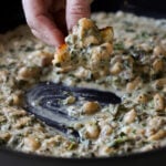 scooping up some kali mirch beans with sourdough bread