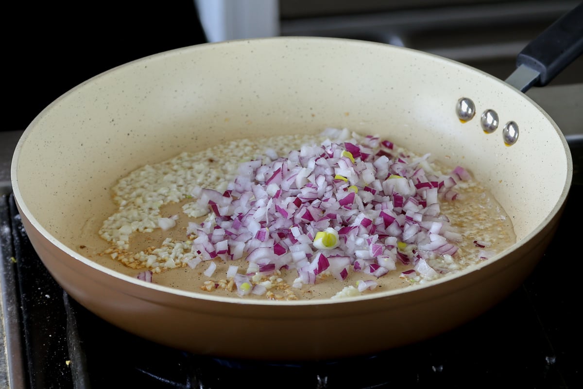 adding onion to the pan