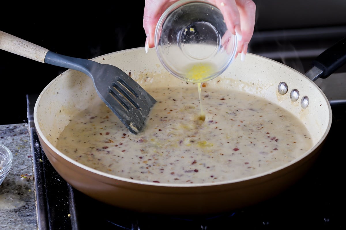 adding lemon juice to the pan
