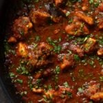 close-up of malvani chicken curry in the pan after cooking