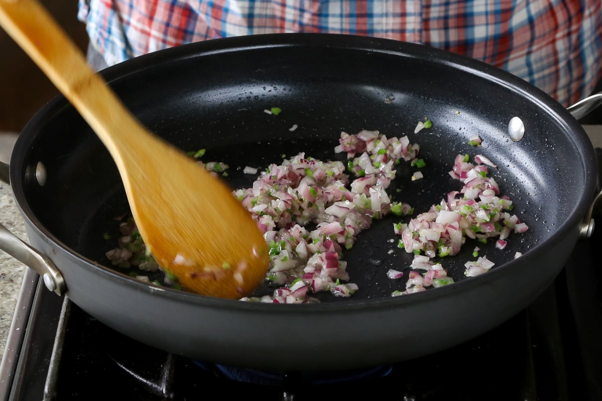 onion and green chili in the pan after cooking