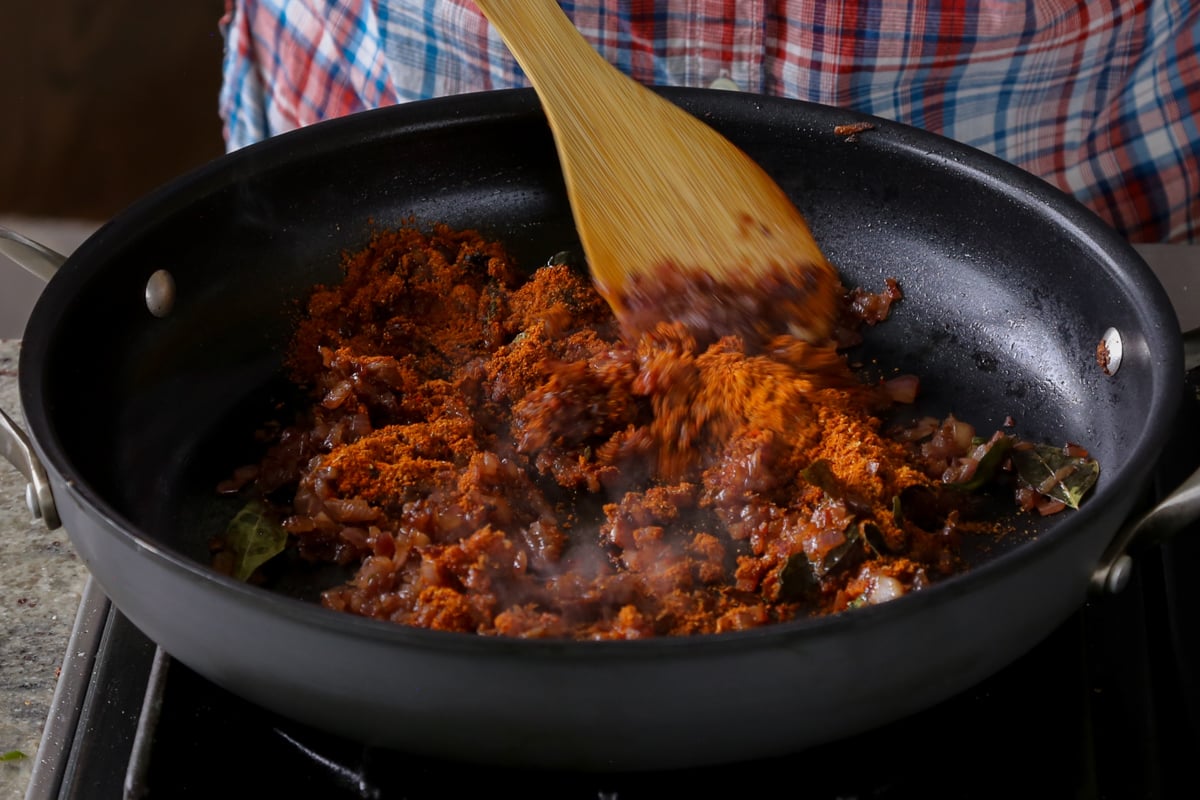 adding spice mixture to the cooked onion