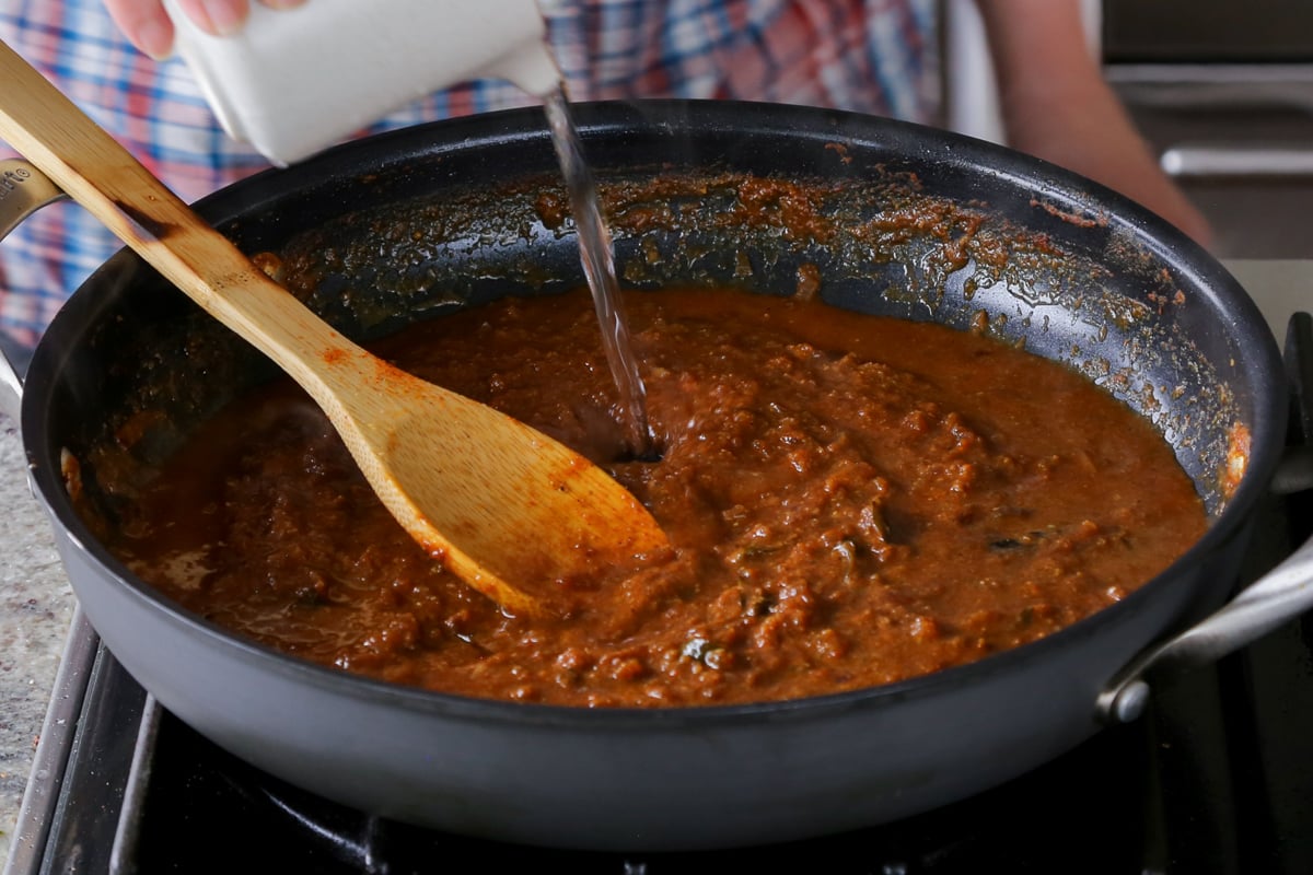 adding water to the sauce
