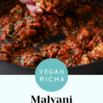 Malvani chicken curry in the pan being scooped up with flatbread, text overlay