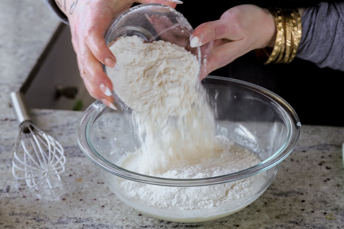 adding dry ingredients to the wet ingredients
