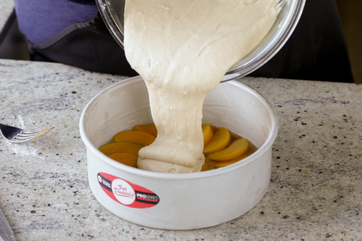 pouring the batter into the cake pan