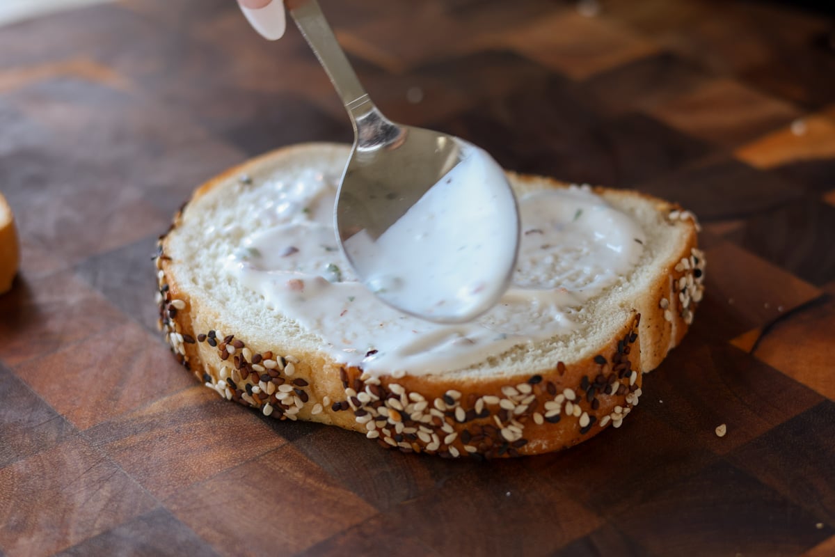 spreading mayo on the bread