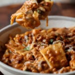 spooning a bite of creamy lasagna soup