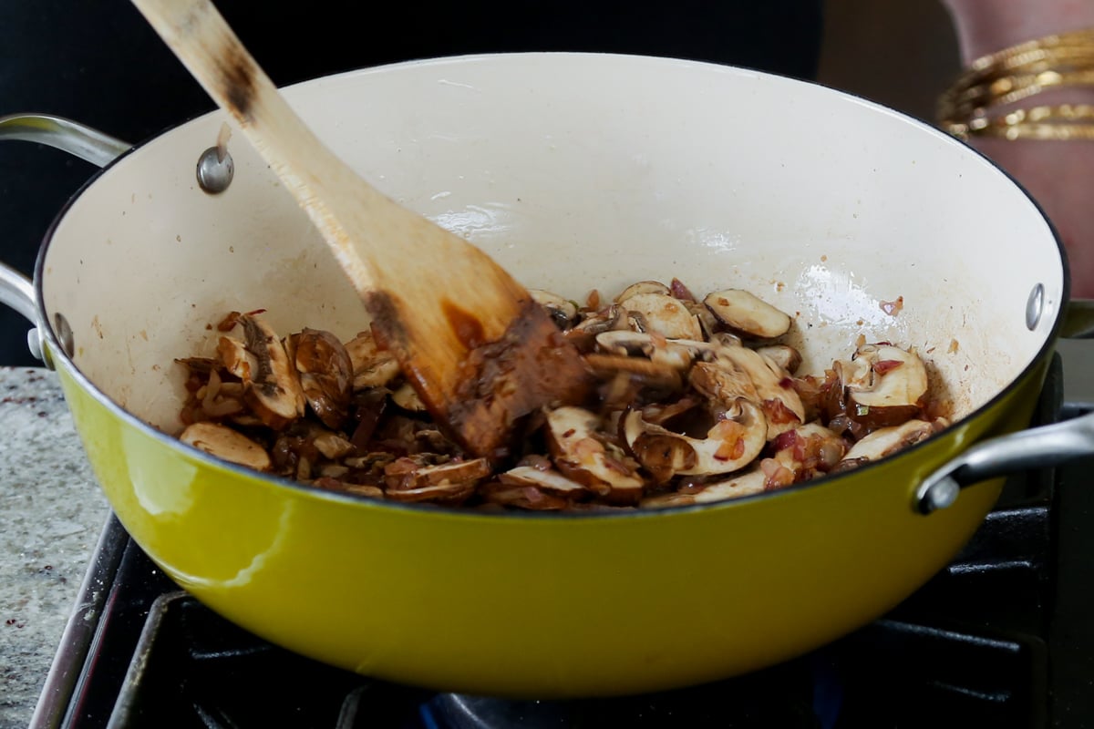 stirring in the mushrooms