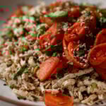 close-up of shredded tofu topped with roasted carrots in a bowl