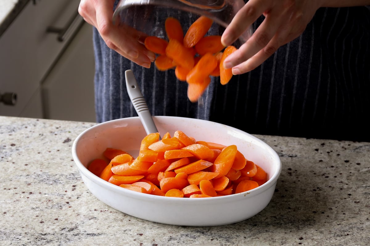 adding carrots to the pan