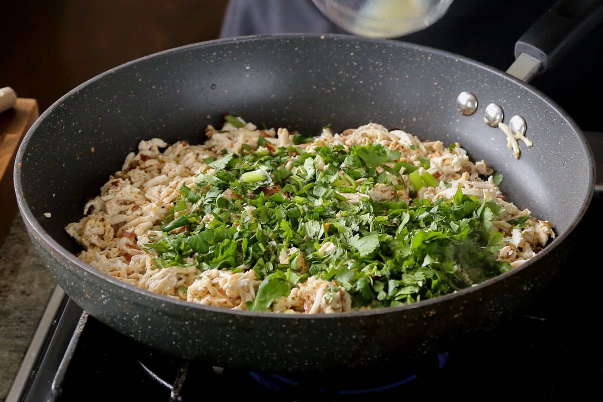 adding cilantro to the tofu