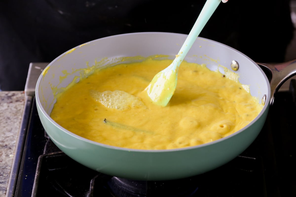 bubbling curry sauce in the pan