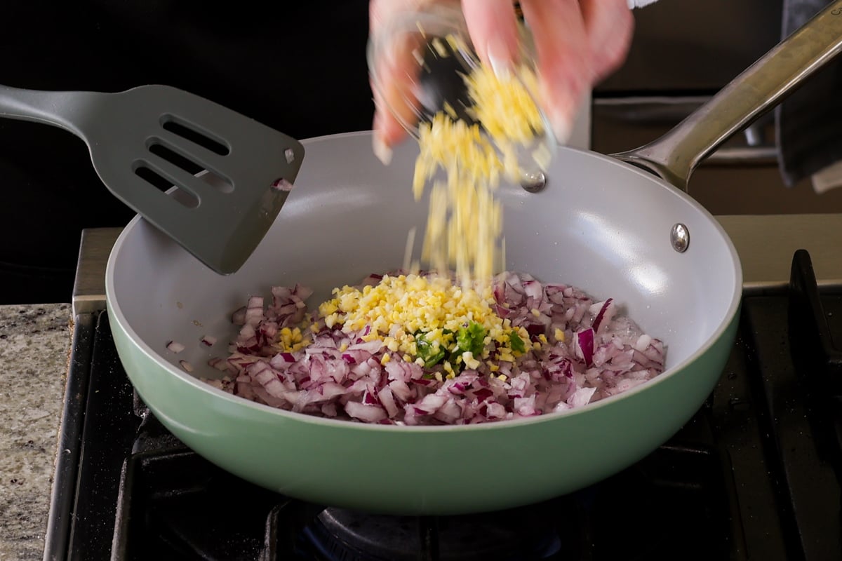 adding rest of the aromatics to the pan