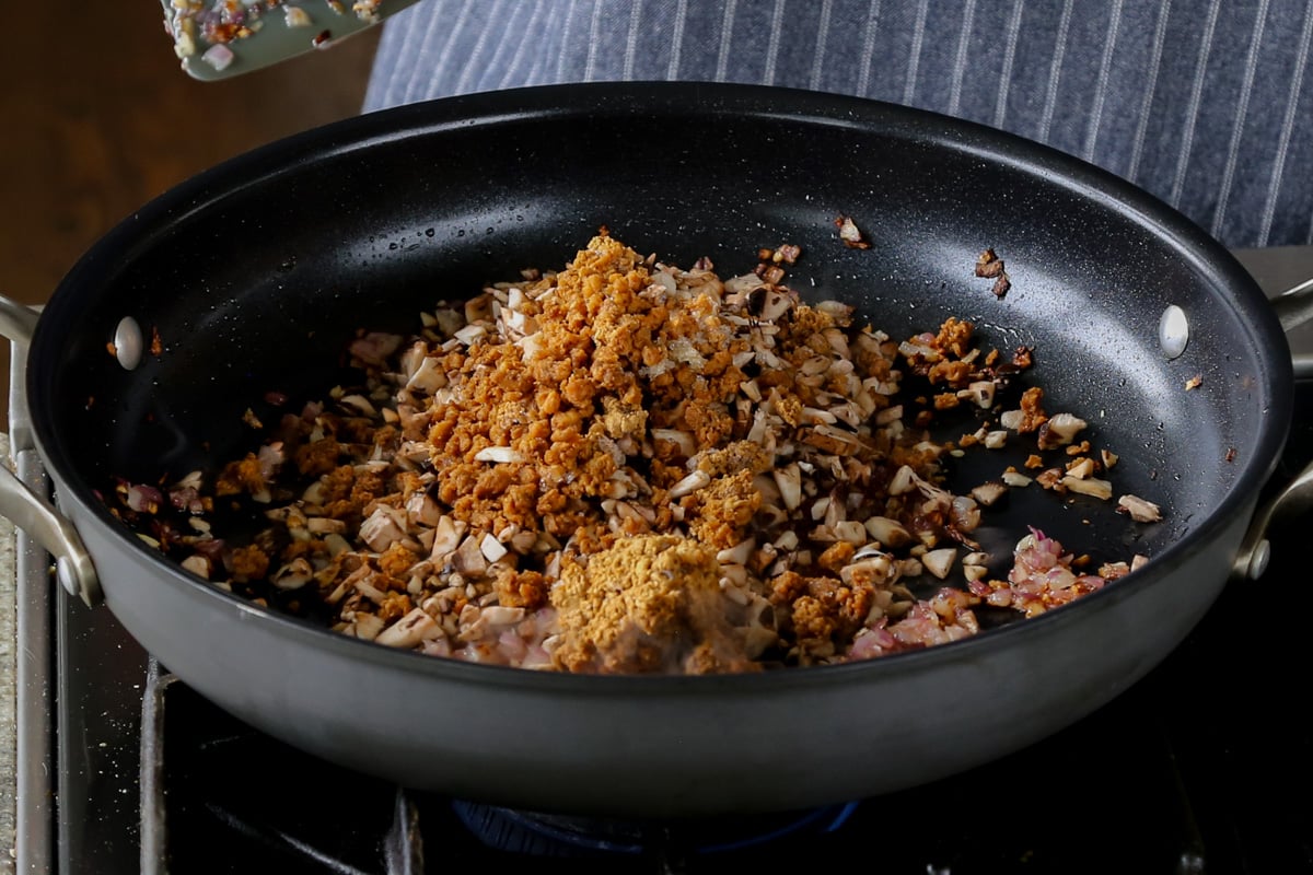 adding veggie crumbles to the pan