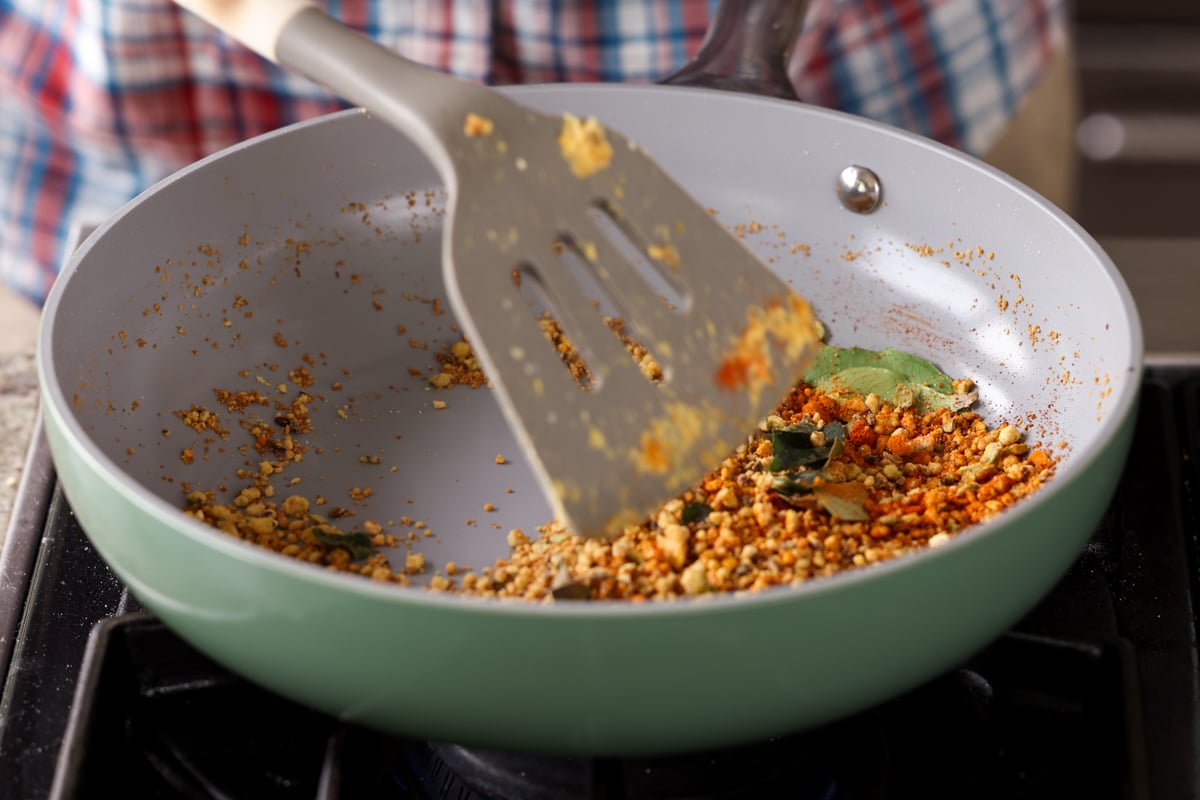 stirring in the whole spices