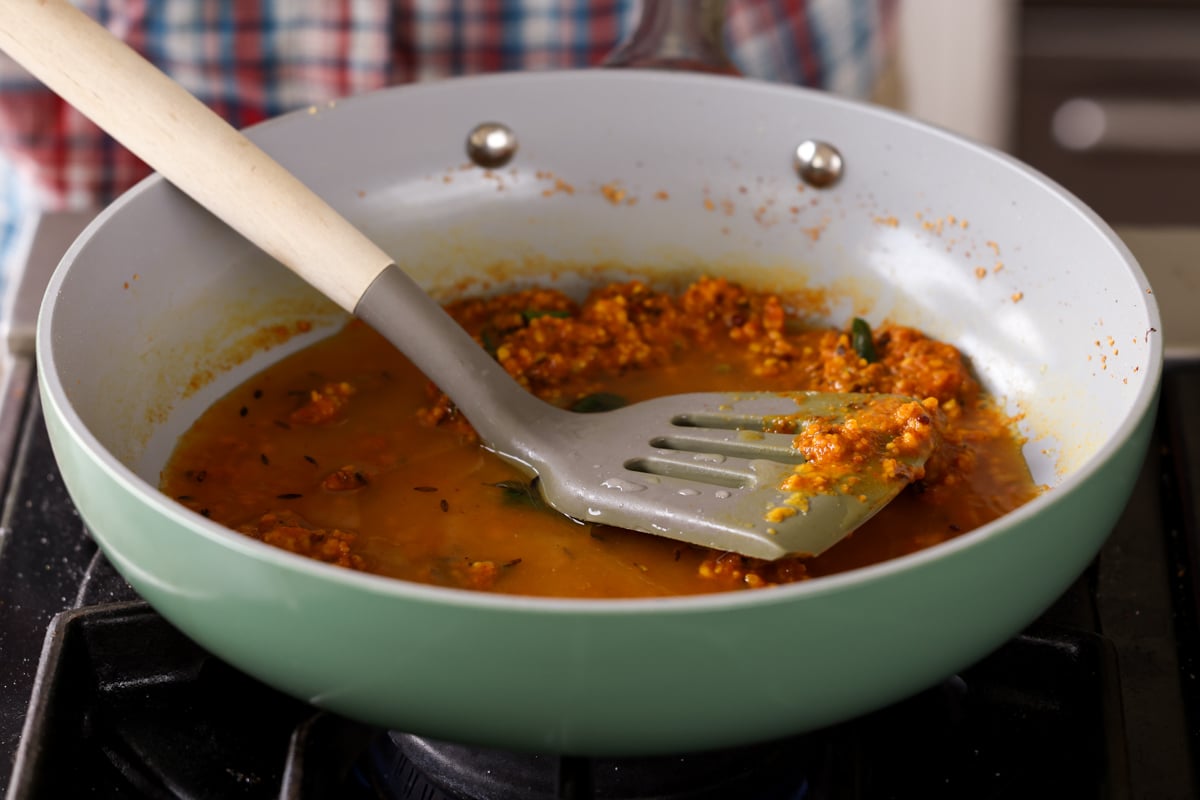 adding a little water to the chickpea flour mixture