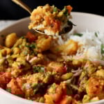 spoon taking a bite of Sindhi kadhi