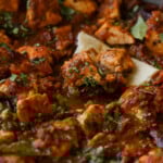 Chettinad pepper chicken curry in the pan with flatbread