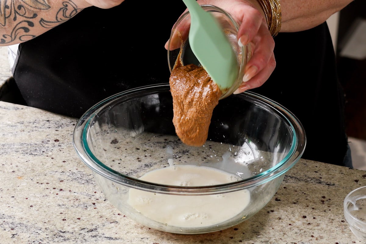 adding wet ingredients to the mixing bowl