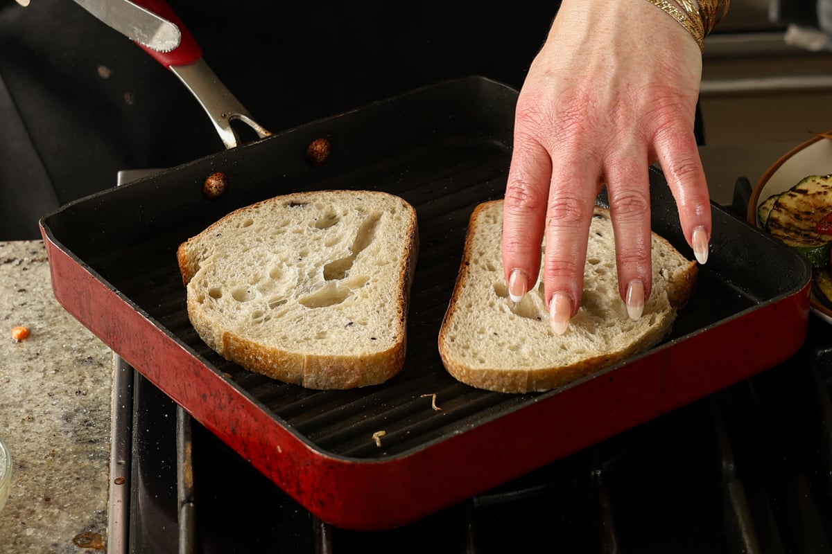 toasting the bread on the grill pan