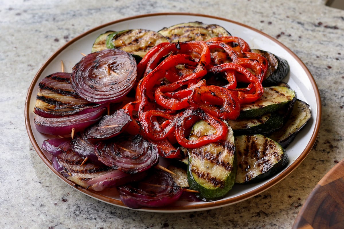 grilled veggies and tofu piled onto a plate