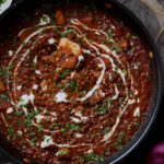 lentils vindaloo in the pan after adding the toppings