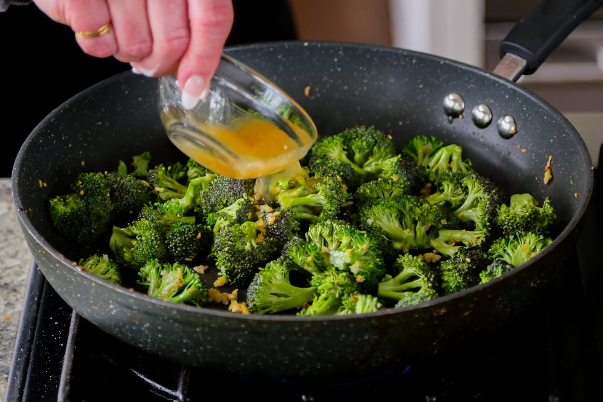 adding stock to the pan