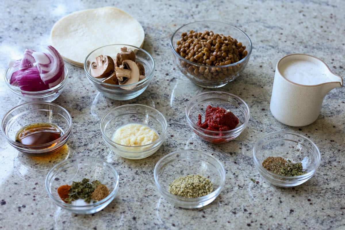 vegan smash burger taco ingredients in bowls on the kitchen counter