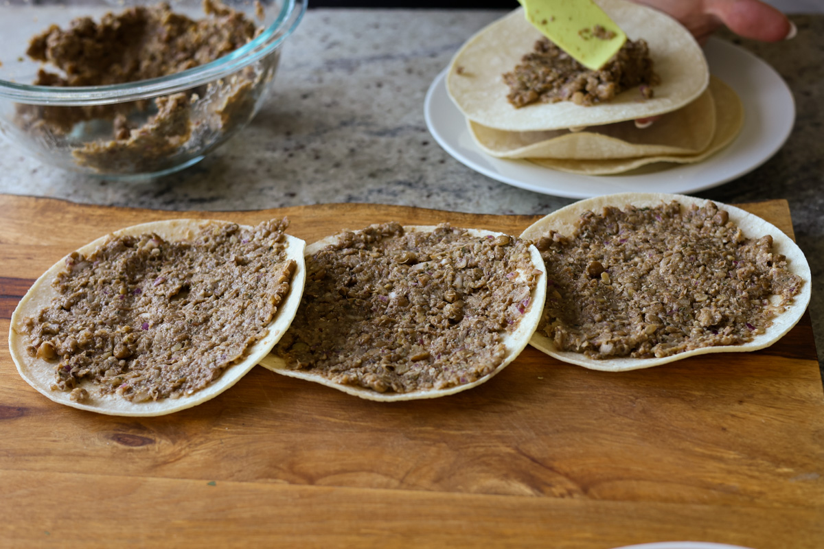 tortillas spread with the lentil meat mixture