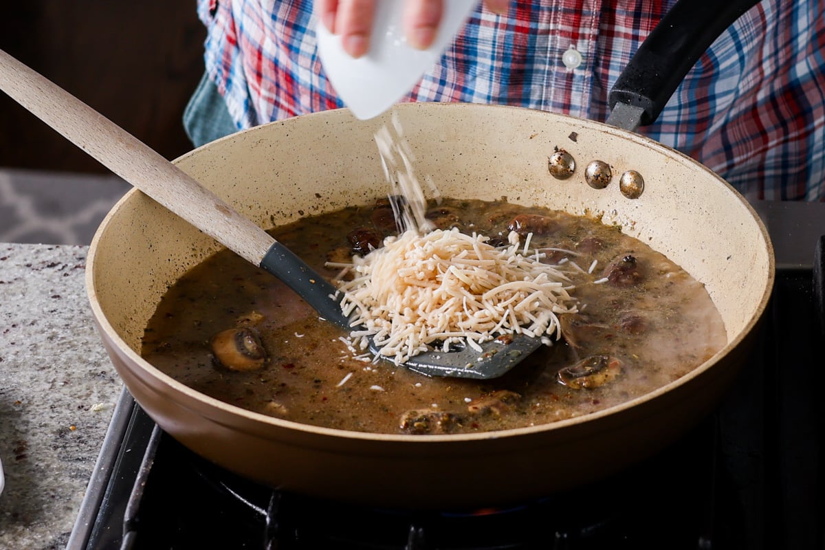 adding vegan cheese to the pan