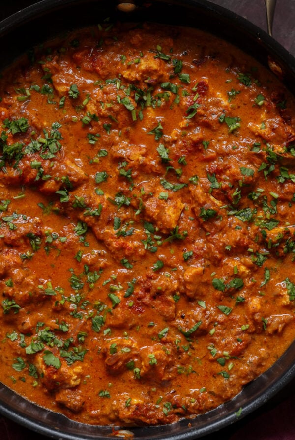 chicken angara in the pan with garnishes